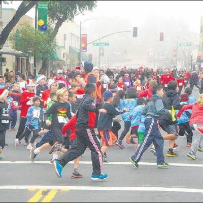 Kids run down the Downtown Modesto streets