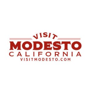 Modesto Convention & Visitors Bureau logo. Sponsor of the Spirit of Giving 5K Run/Walk